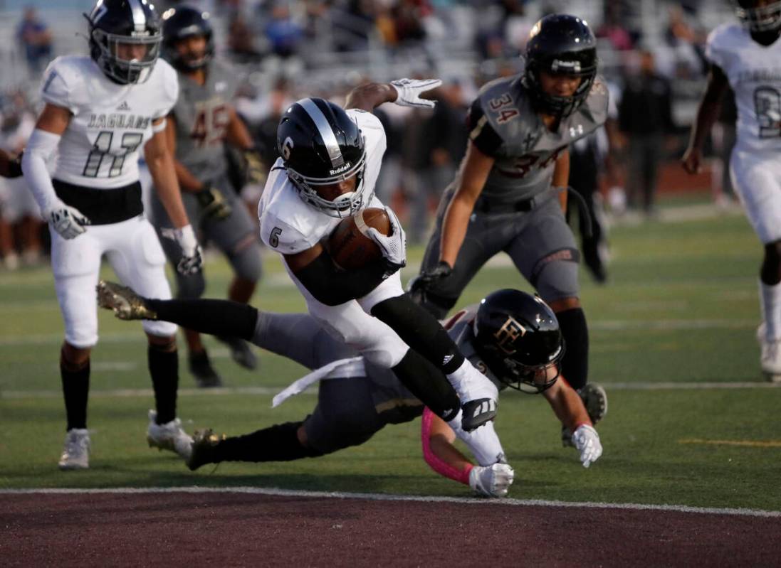 Desert Pines High School's Ferrari Busby (6) score a touchdown over Faith Lutheran School's Jac ...