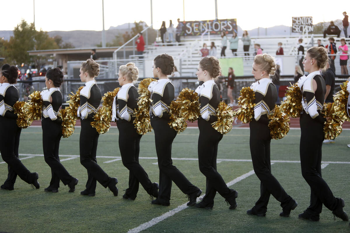 Faith Lutheran School's dance team members line up before a football game against Desert Pines ...