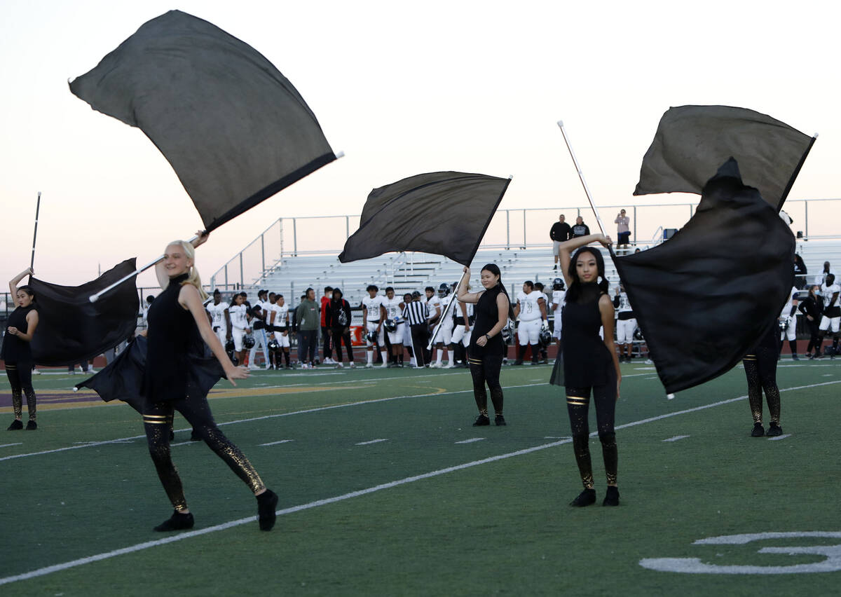 Members of Faith Lutheran School's color guard perform before a football game against Desert Pi ...