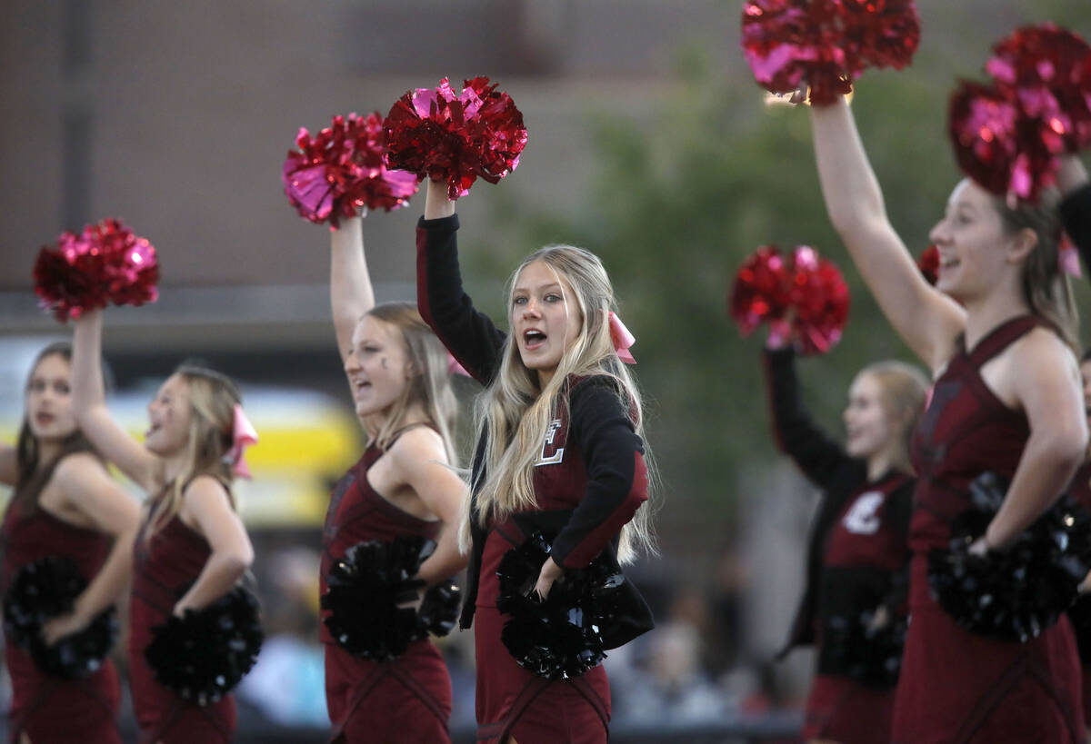 Faith Lutheran School's cheerleaders performs before a football game against Desert Pines High ...