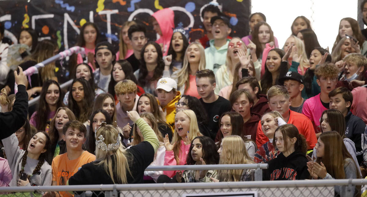 Faith Lutheran School's fans cheer during the first half of a football game against Desert Pine ...