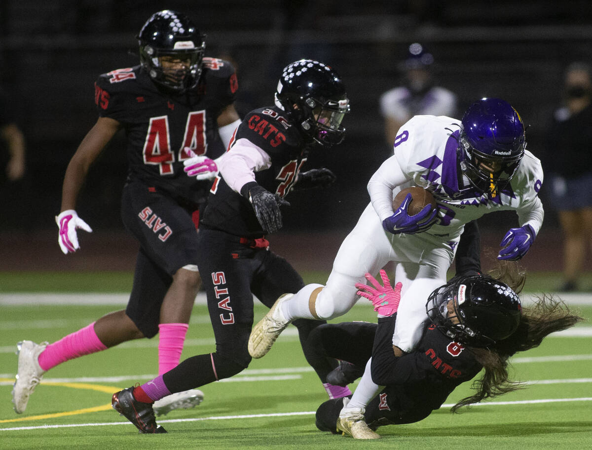 Las Vegas' defensive back Kawika Lopez (8) takes down Durango's wide receiver Tanner Nitsche (8 ...