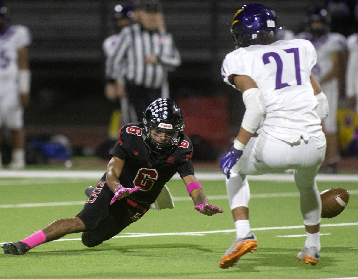 Las Vegas' wide receiver Stephan Hunt (6) fumbles while Durango's defensive back Daurell Ilaoa ...