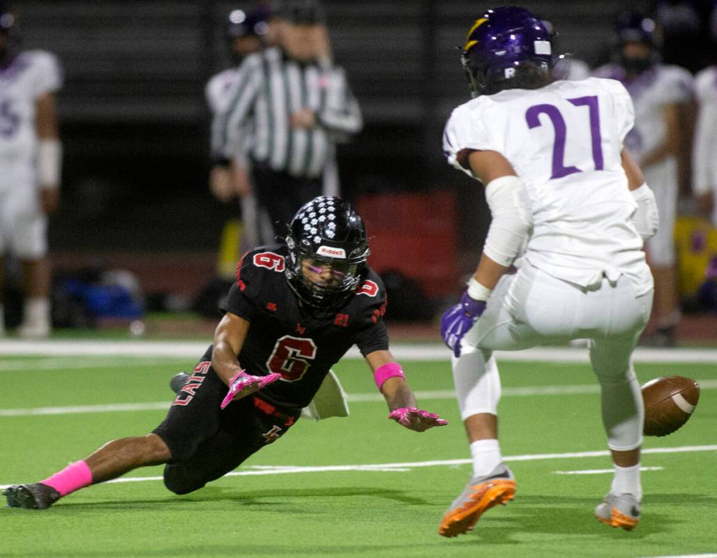 Las Vegas' wide receiver Stephan Hunt (6) fumbles while Durango's defensive back Daurell Ilaoa ...