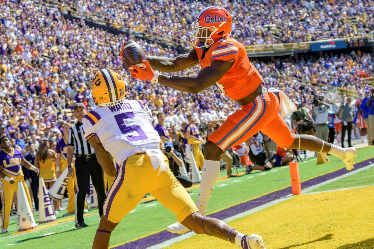 Florida wide receiver Justin Shorter (4) scores a touchdown against LSU safety Jay Ward (5) in ...