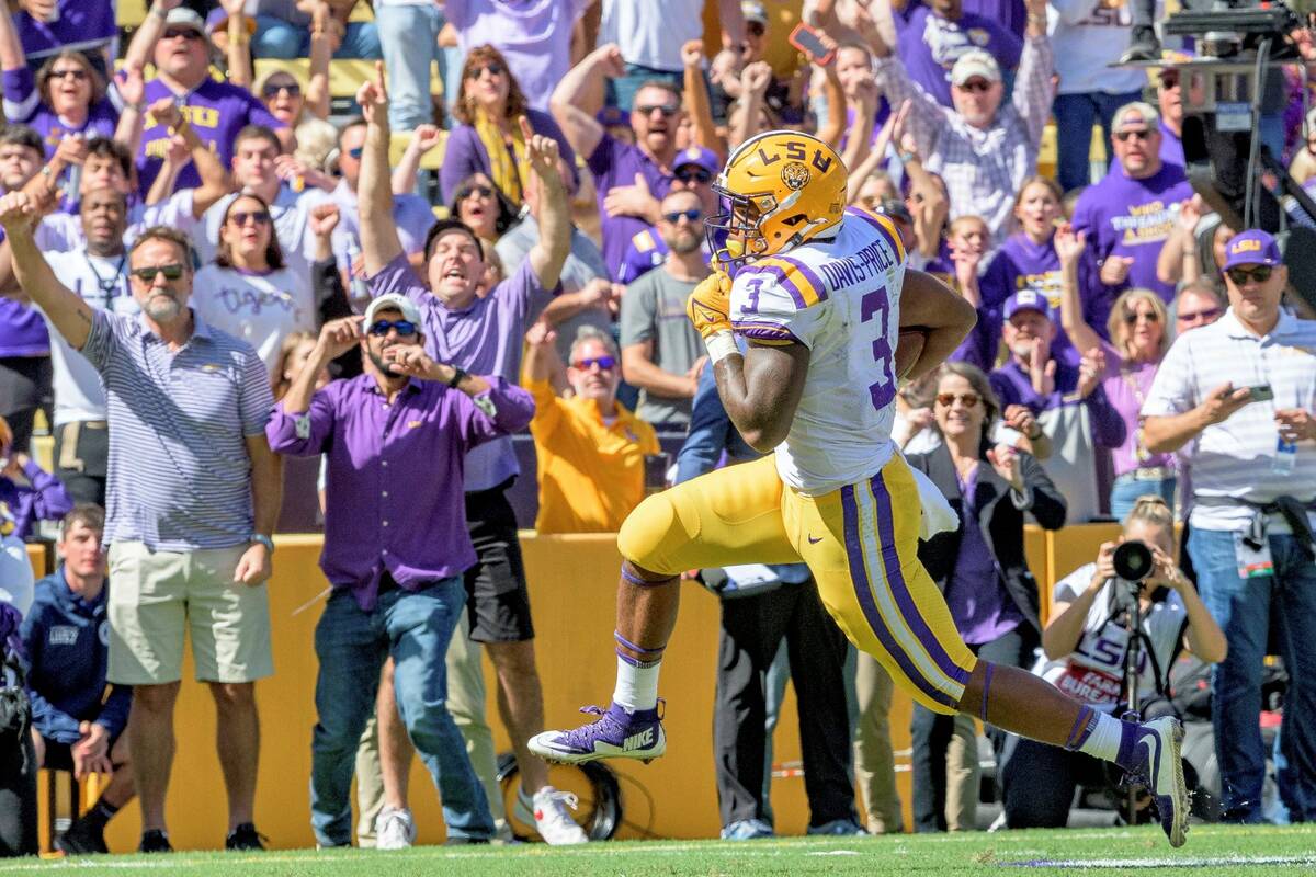 LSU running back Tyrion Davis-Price (3) runs for a touchdown in the first half of an NCAA colle ...
