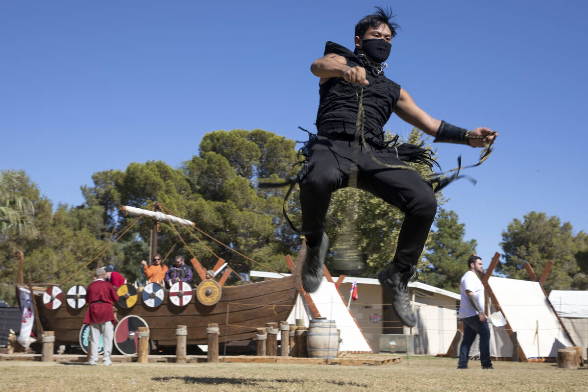 Kai Aquino practices flow arts with a rope dart during the Age of Chivalry  Renaissance Festival …