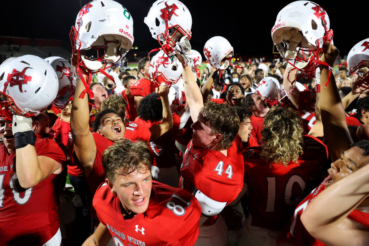 Arbor View players celebrate a 22-21 win over Desert Pines during a football game at Arbor View ...