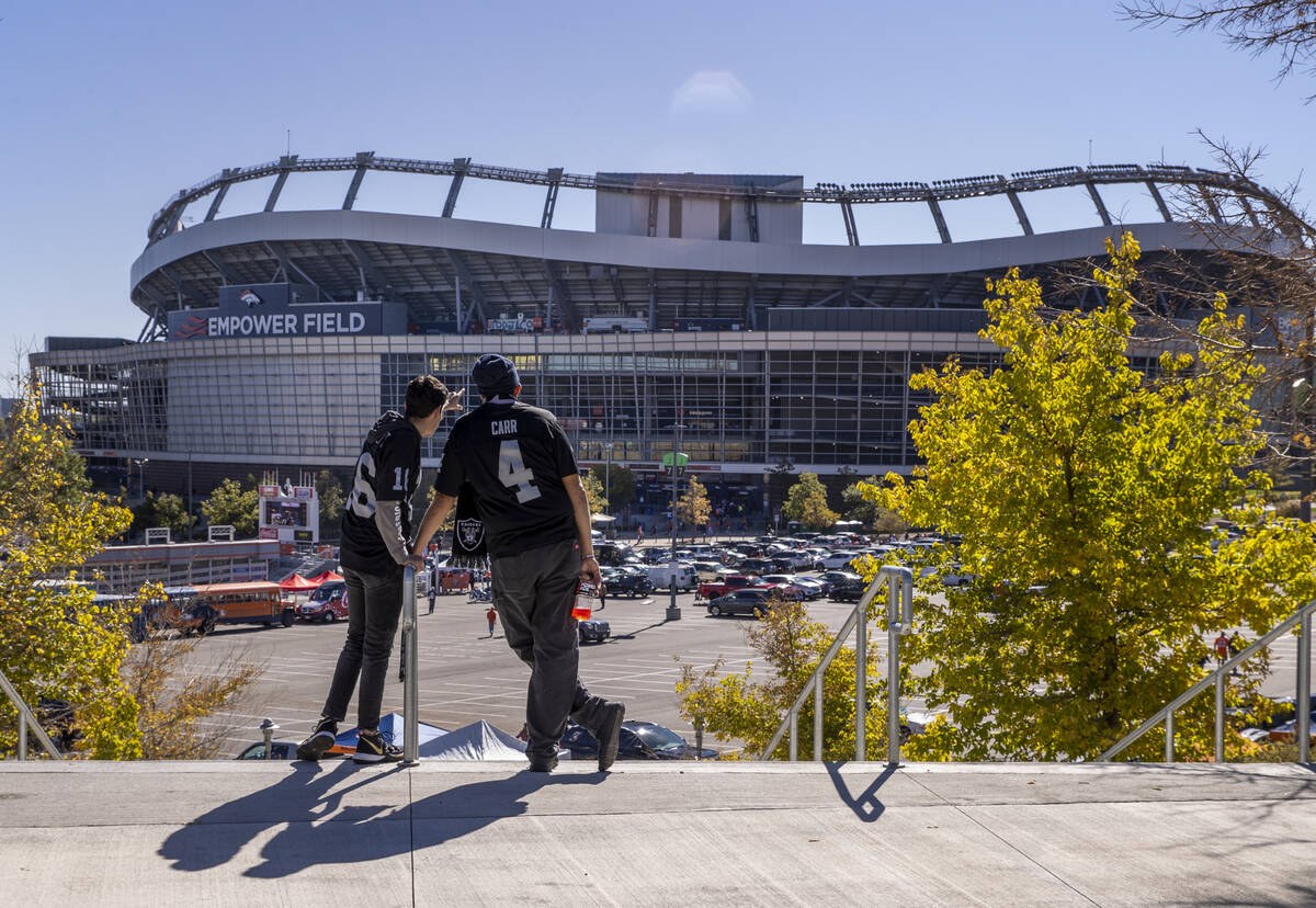 Raiders' fans Antonio and Manuel Artiaga of Albuquerque check out the stadium in the tailgate a ...
