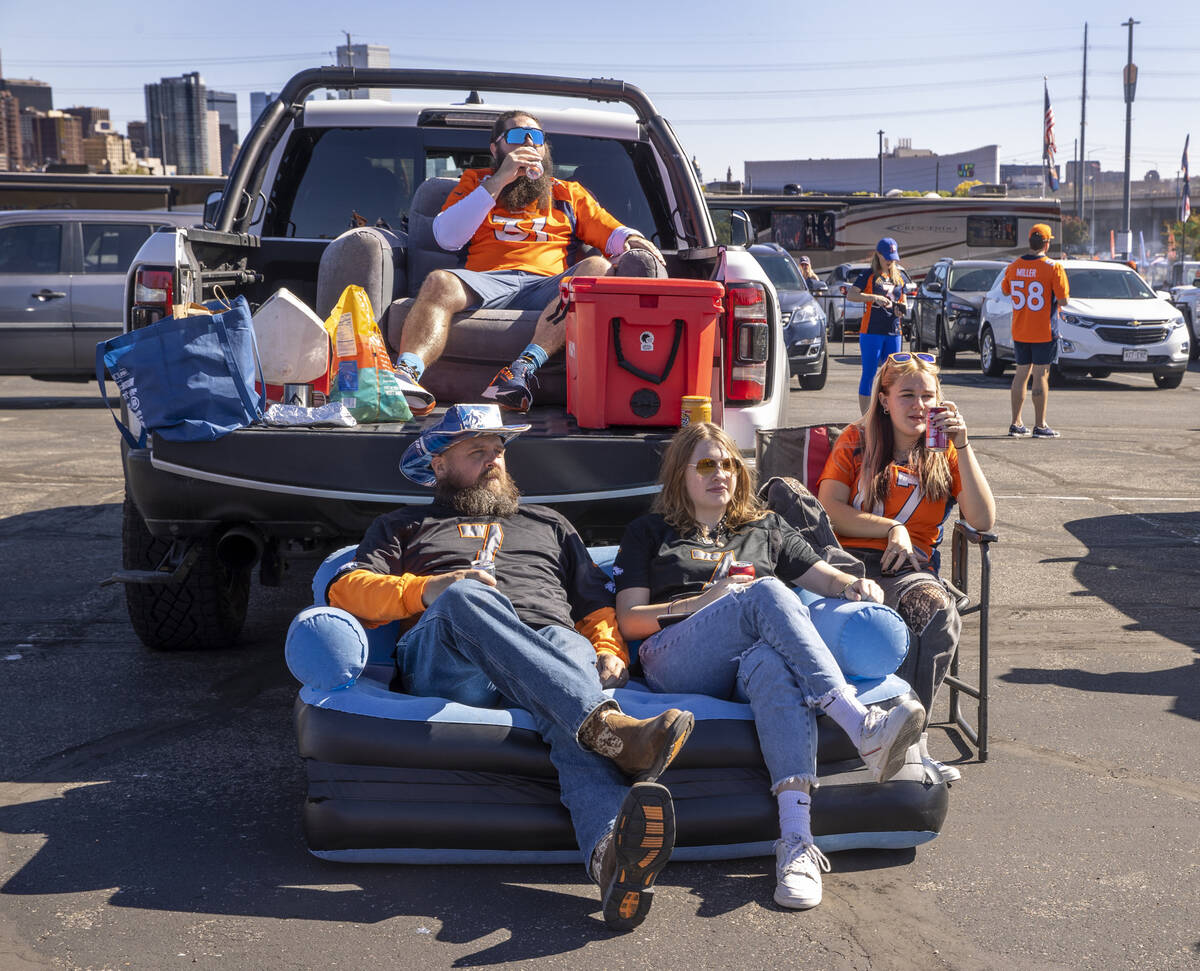 Denver Broncos fans Nate Van Cleave, Counterclockwise from top, Mike Miles, Reagan Miles and Lu ...