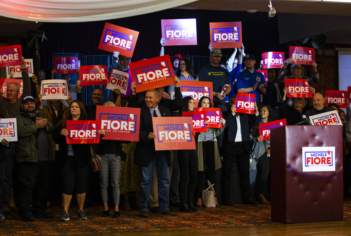 Supporters of Las Vegas Councilwoman Michele Fiore, not pictured, cheer as she announces her gu ...