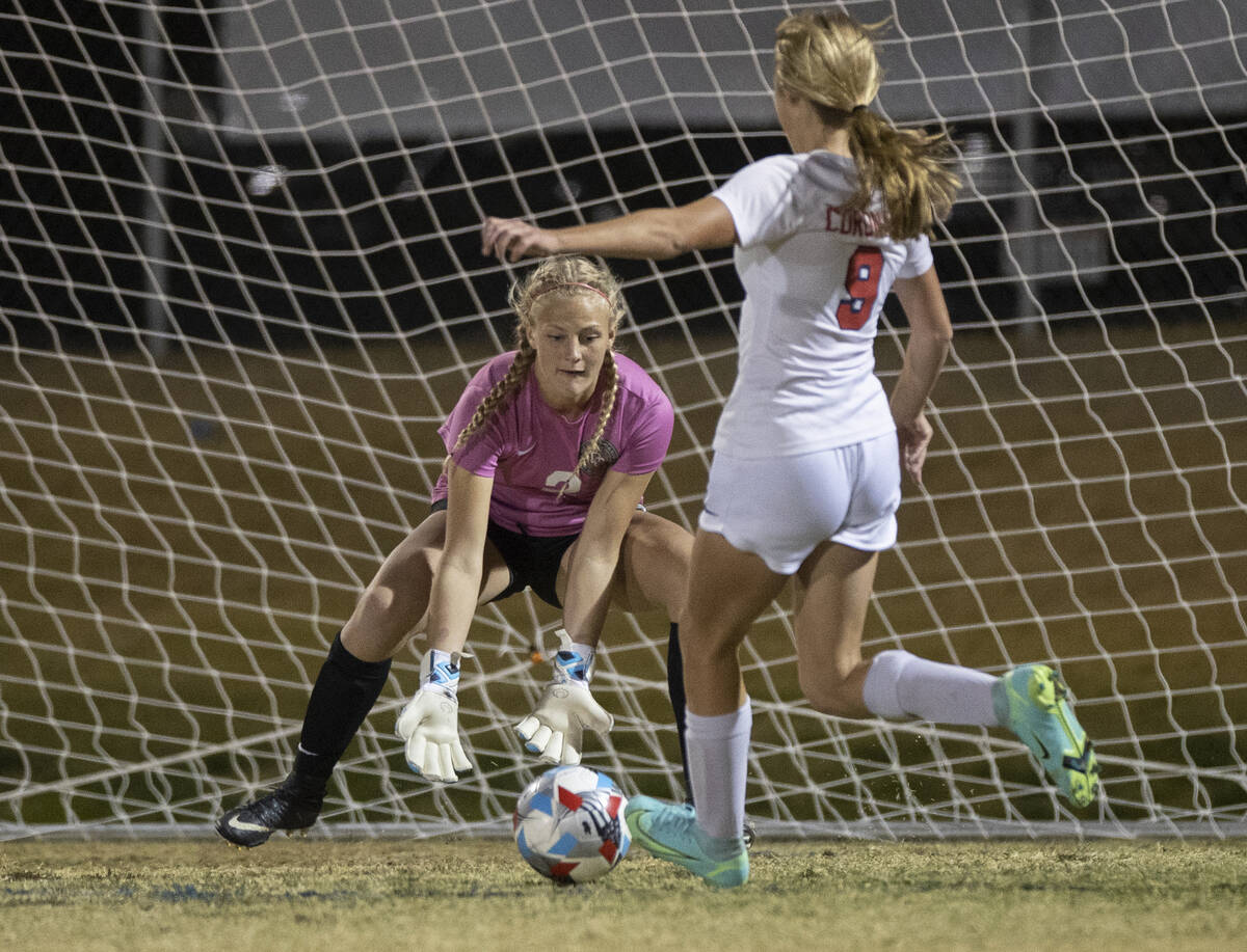 Desert Oasis' Bryanna Perry (2) makes a prevention  against Coronado's Molly Russell (9) successful  the archetypal  ...