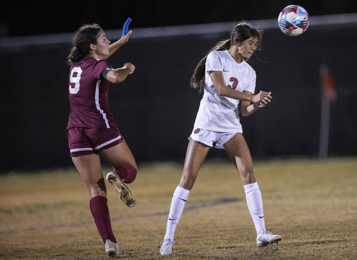 Coronado's Chrysta Vasquez (3) heads the shot  with Desert Oasis' Emma D’Angelo (9) defen ...