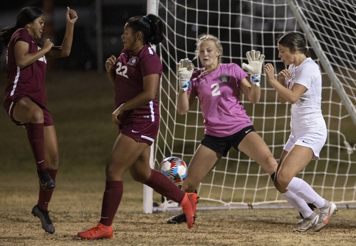 Desert Oasis' Bryanna Perry (2) tries to make a save against Coronado's Xayla Black (10) in the ...