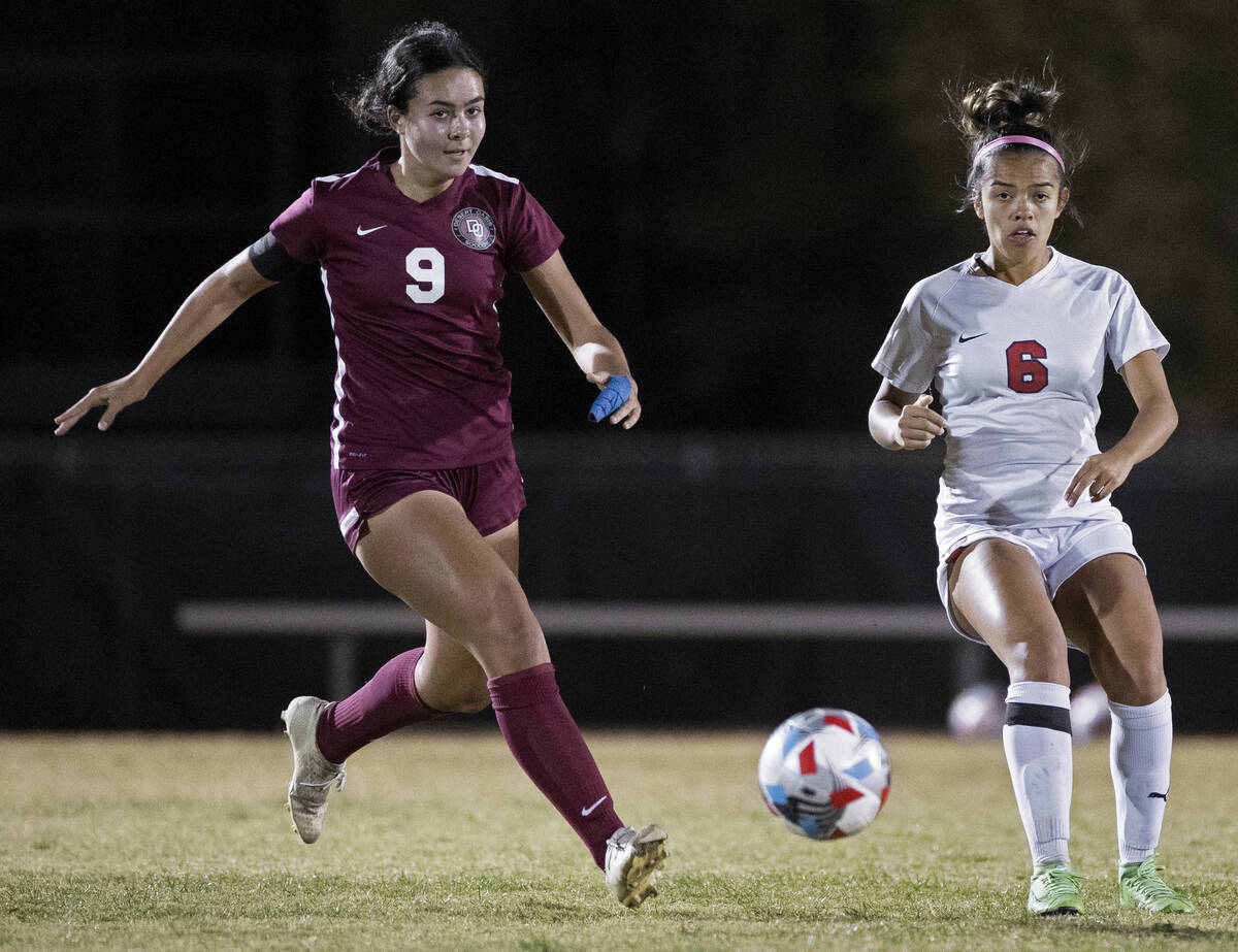 Desert Oasis' Emma D’Angelo (9) pushes the ball up field past a Coronado defender in the ...