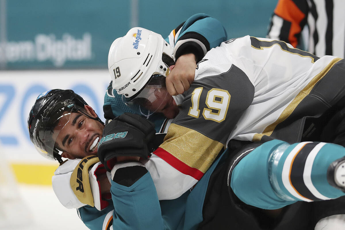 San Jose Sharks left wing Evander Kane (9), bottom, fights with Vegas Golden Knights right wing ...