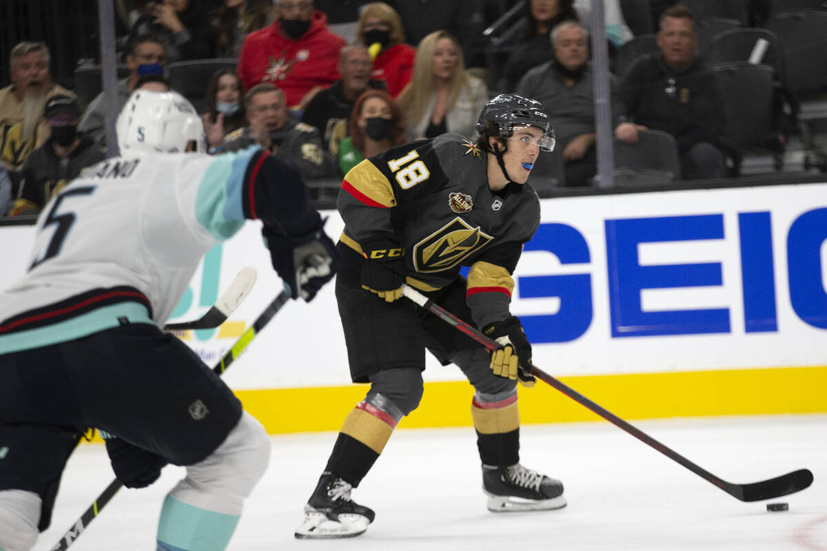 Golden Knights left wing Peyton Krebs (18) heads for the net as Kraken defenseman Mark Giordano ...