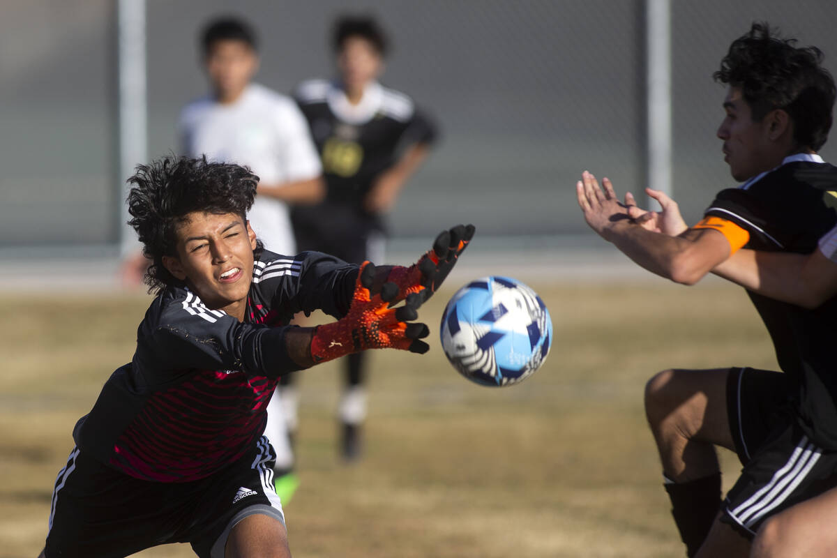 Green Valley's Edwin Lagunas-Monroy (0) misses the save on a goal shot by Sunrise Mountain's Kr ...