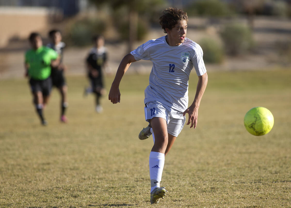 Green Valley's Kevin Kucik (12) dribbles up the field during a boys high school soccer game aga ...