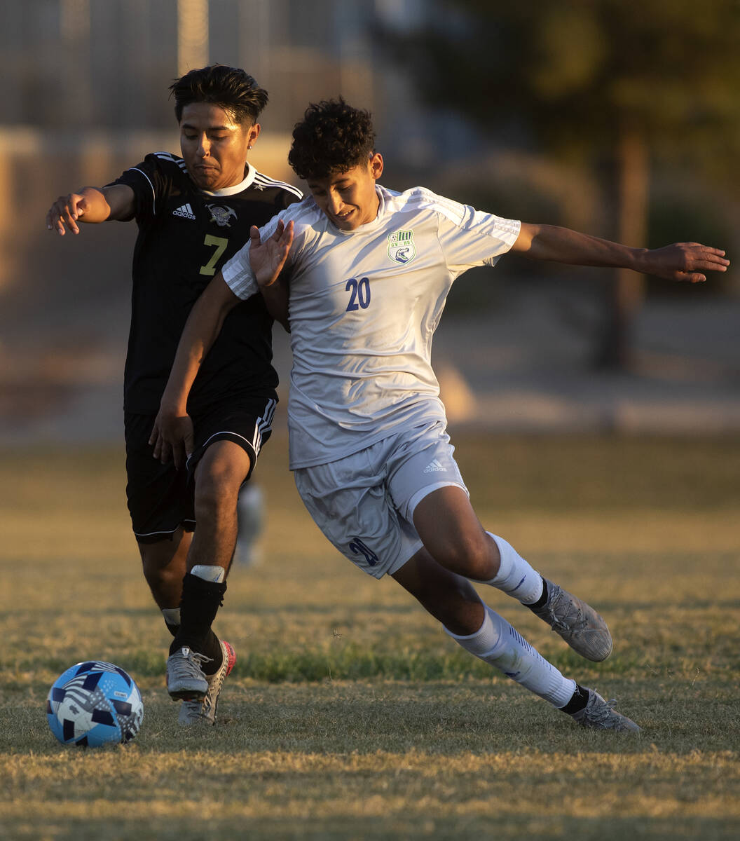 Sunrise Mountain's Mario Juarez (7) and Green Valley's Anwar Ben Rhouma Torres (20) compete for ...