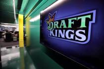 In this May 2, 2019, file photo, the DraftKings logo is displayed at the sports betting company ...