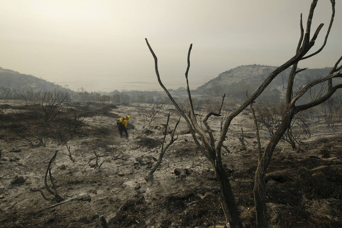 In this Wednesday, Oct. 13, 2021 file photo, County of Santa Barbara Fire Department firefighte ...