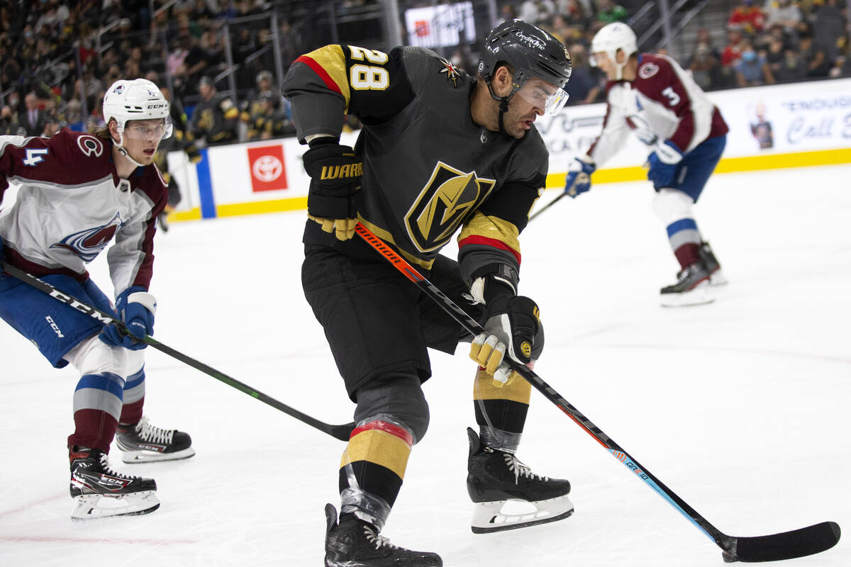 Golden Knights left wing William Carrier (28) gains control of the puck followed by Avalanche d ...
