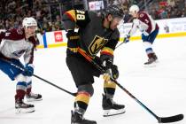 Golden Knights left wing William Carrier (28) gains control of the puck followed by Avalanche d ...