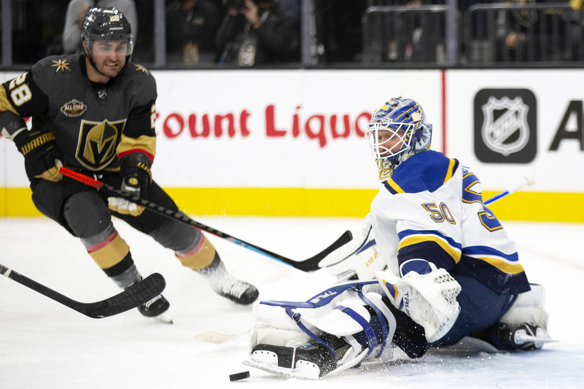 Golden Knights left wing William Carrier (28) watches as Blues goaltender Jordan Binnington (50 ...