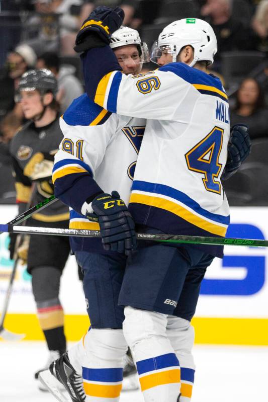Blues right wing Vladimir Tarasenko (91) and Blues defenseman Jake Walman (46) celebrate a win ...