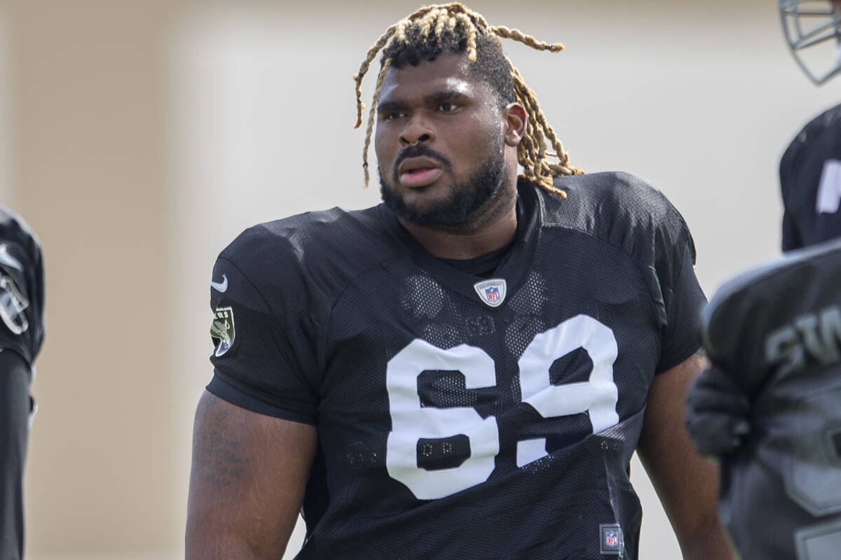 Raiders offensive lineman D.J. Fluker (69) looks on during team drills during a practice sessio ...