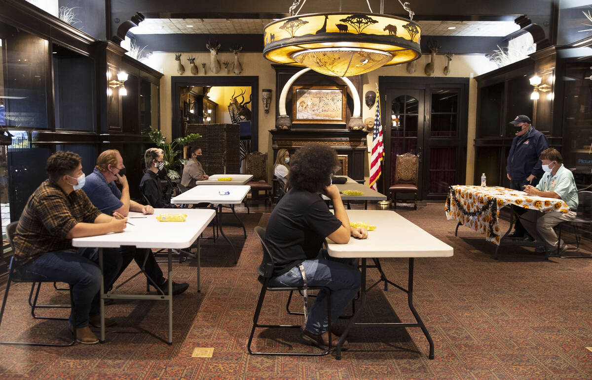 Job seekers wait to be called for an interview at a Bass Pro Shop job fair, on Thursday, Oct. 1 ...