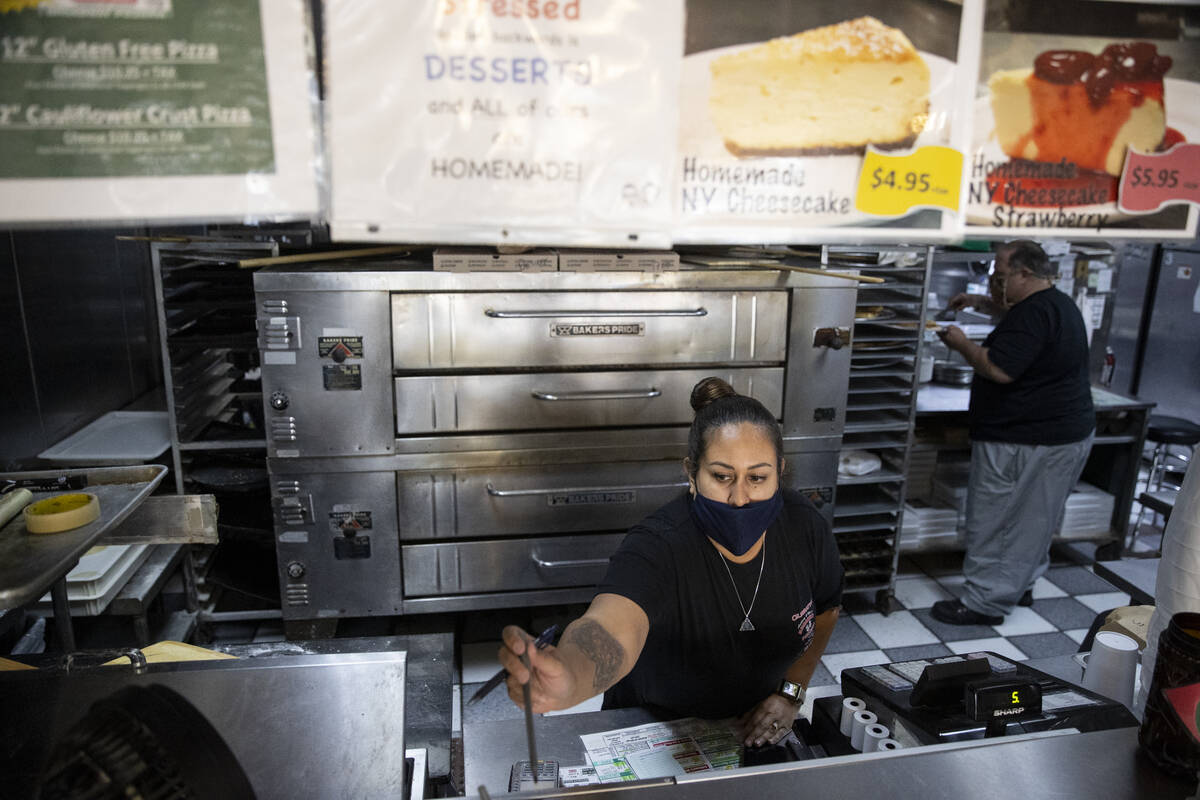 Desiree Perdichizzi works the front counter at Broadway Pizza in Las Vegas, Thursday, Oct. 21, ...