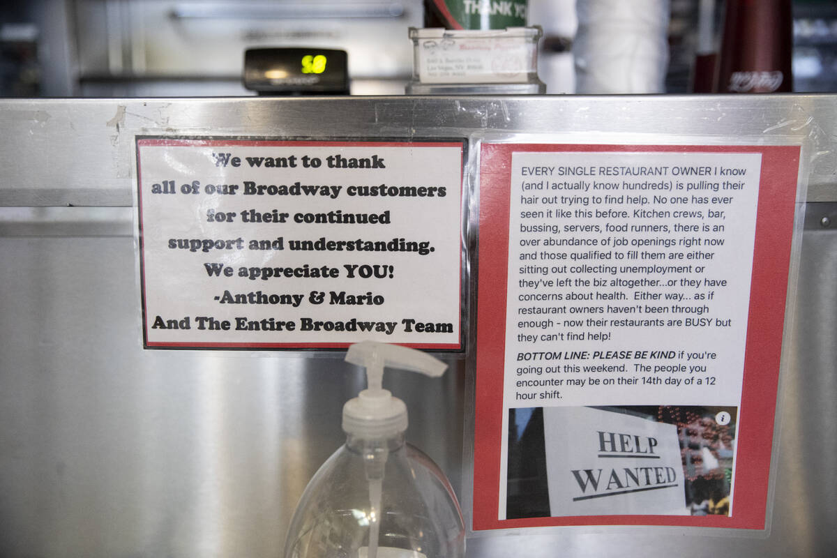A help wanted sign is displayed on the front counter at Broadway Pizza in Las Vegas, Thursday, ...