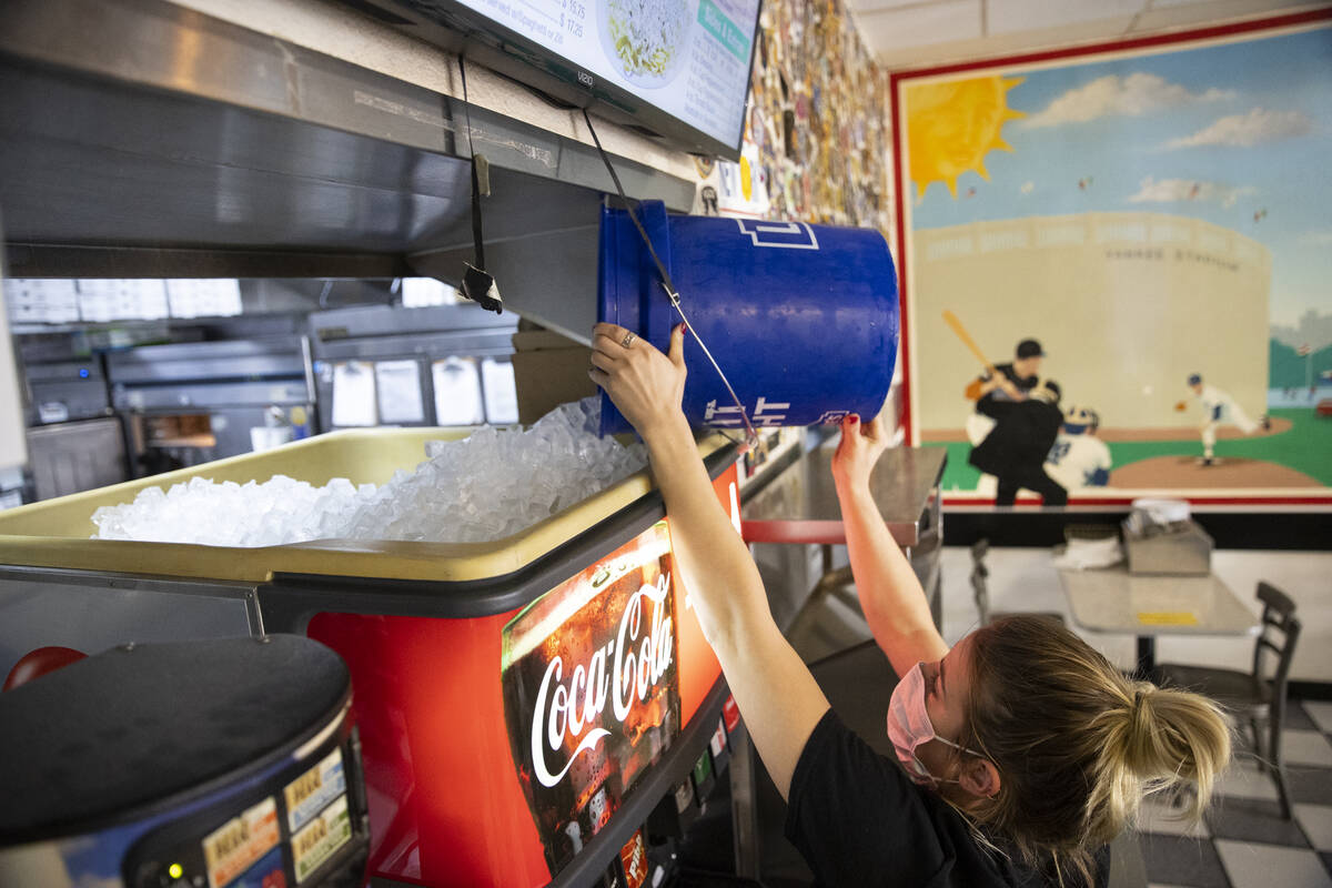 Cashier Bryte Kiser refills ice on the soda machine at Broadway Pizza in Las Vegas, Thursday, O ...