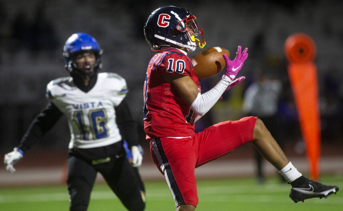 Coronado's Jaylen Garrison (10) catches a pass before scoring a touchdown as Sierra Vista's Mar ...
