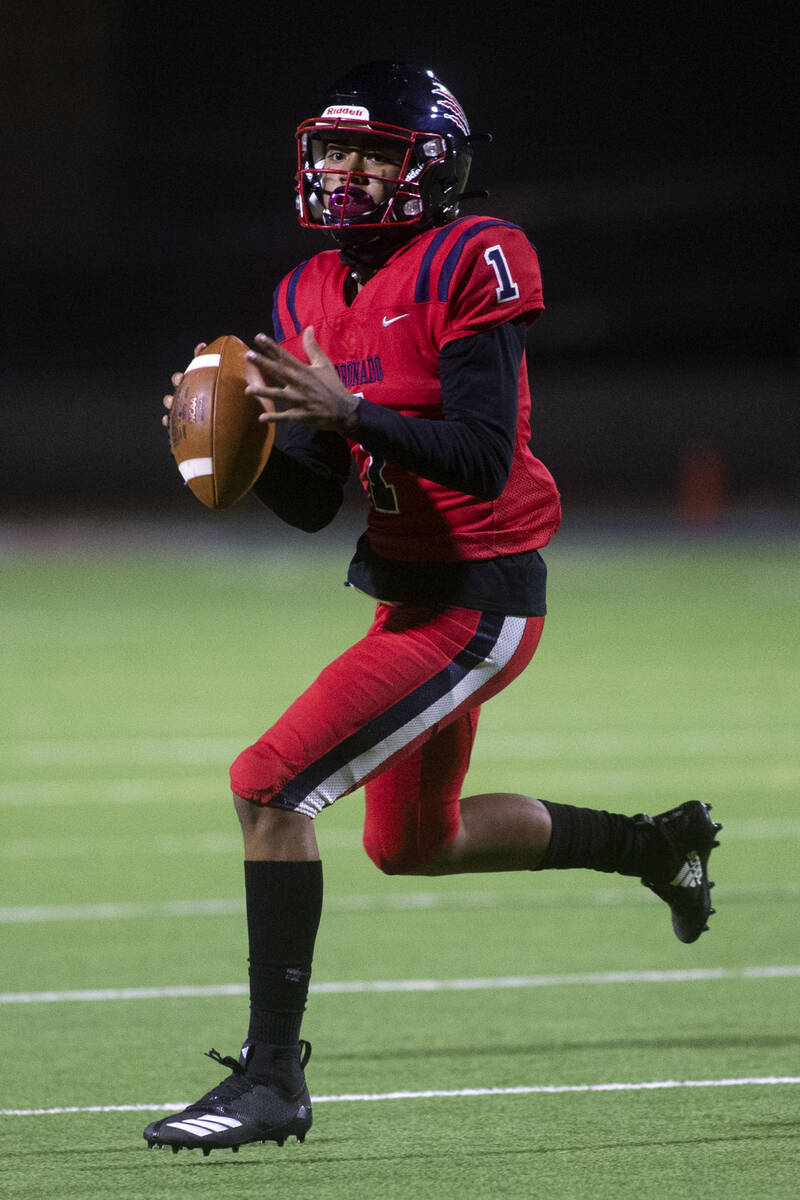 Coronado's quarterback Joshua Andrade (1) looks to pass during the first half of a high school ...