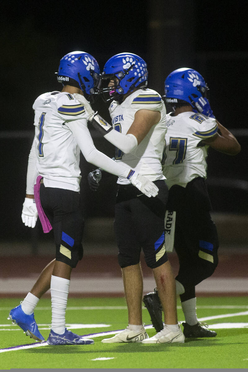 Sierra Vista's quarterback Traivon Dyson (1) is congratulated by his teammate Dylan Torre (8) a ...