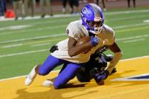 Bishop Gorman High School's Maleik Pabon (8) scores a touchdown over Foothill High School's Kel ...