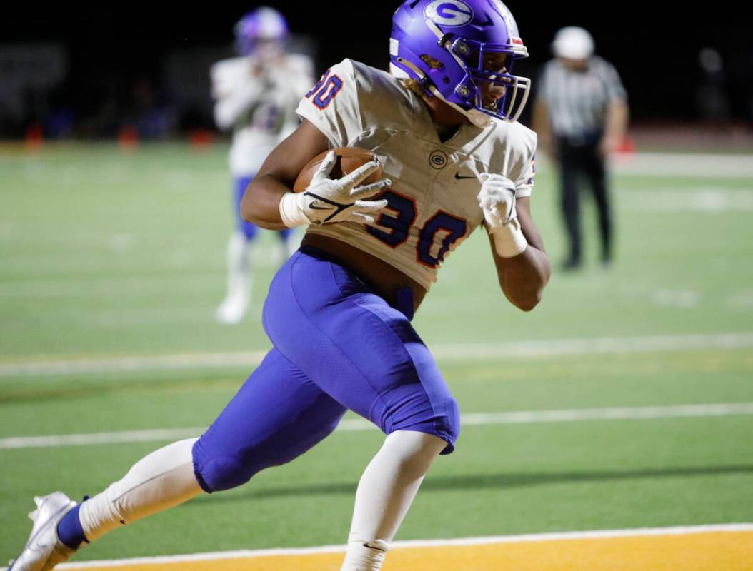 Bishop Gorman High School's William 'Bubba' Proctor IV (30) runs into the end zone for a touchd ...