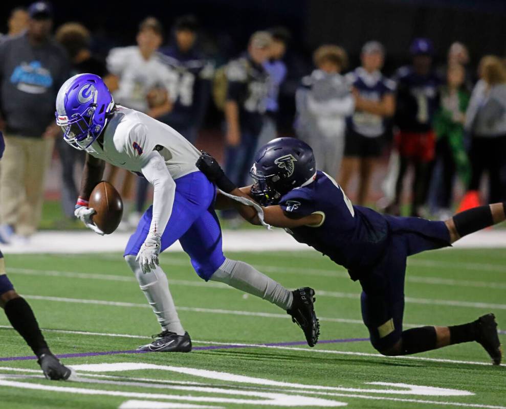 Foothill High School's Christopher Razeeq (2) tries to stop Bishop Gorman High School's Zachari ...