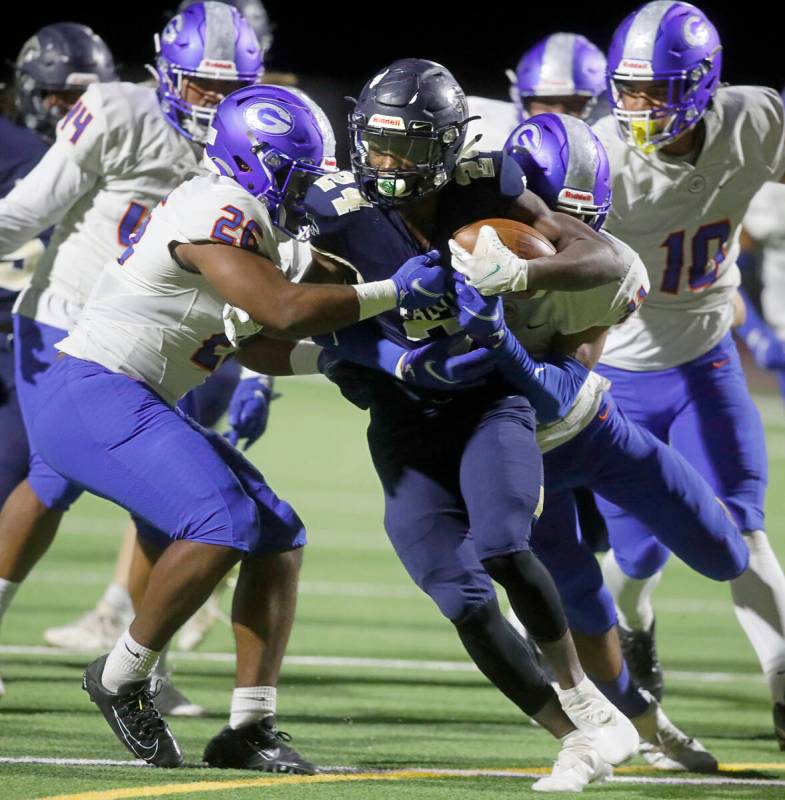 Foothill High School's Keshawn Wilridge Thomas (24) carries a ball against Bishop Gorman High S ...