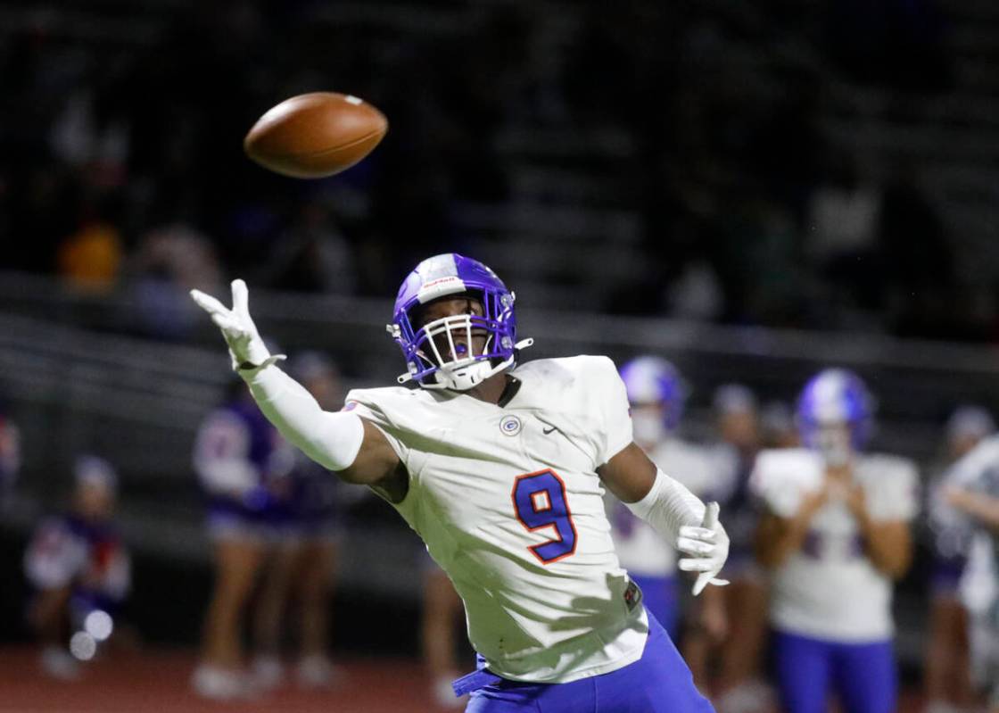 Bishop Gorman High School's Elija Lofton (9) fails to make the catch against Foothill High Scho ...
