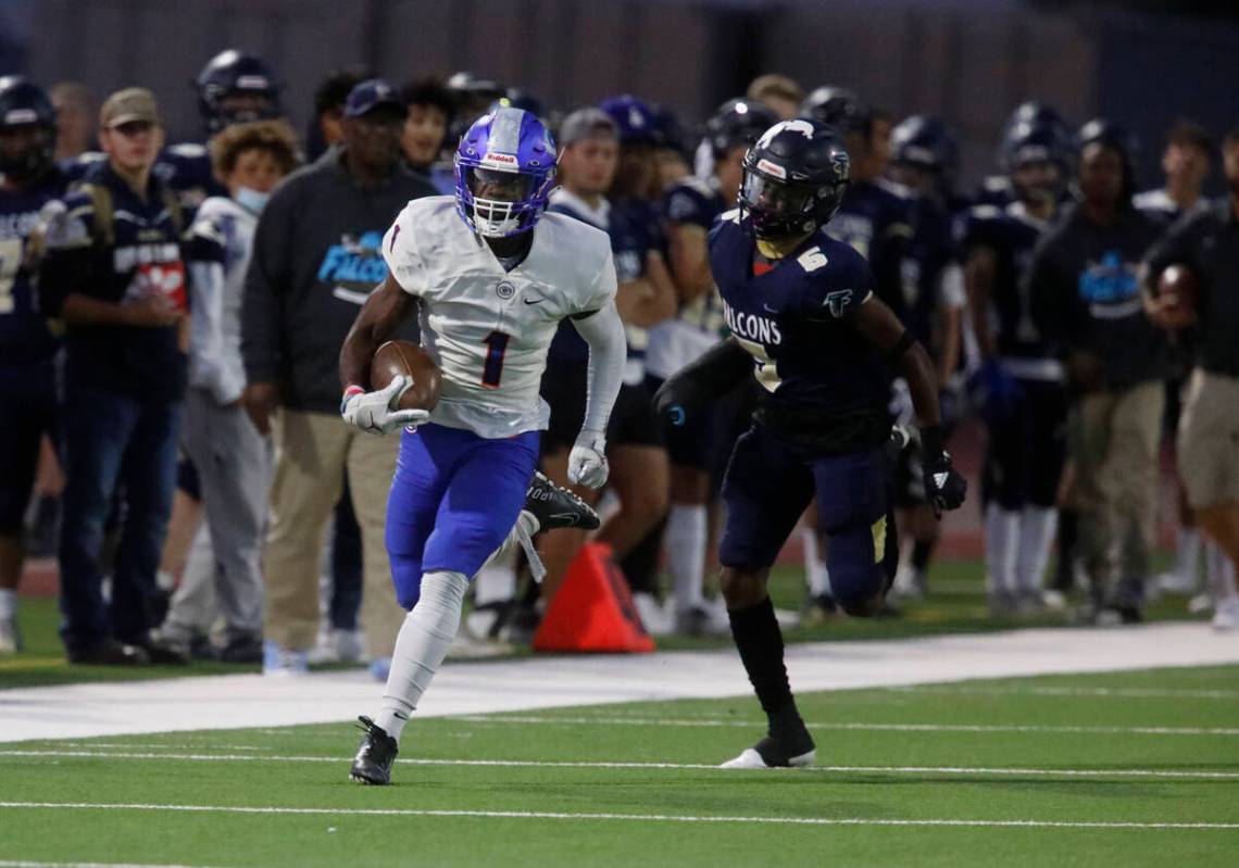 Bishop Gorman High School's Zachariah Branch (1) runs into the end zone for a touchdown as Foot ...