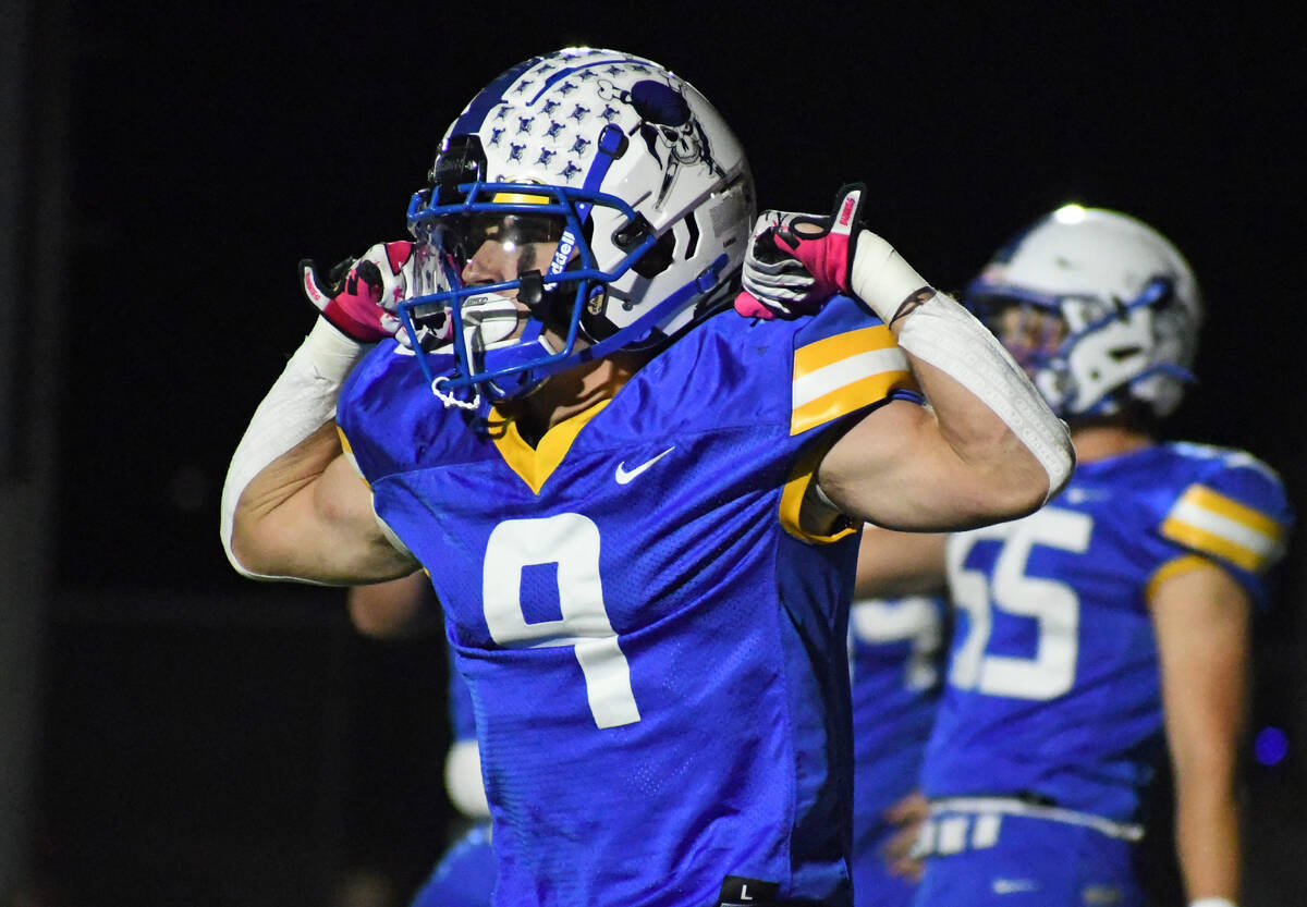 Moapa Valley’s Austin Heiselbetz celebrates a touchdown during the Hammer Game against V ...