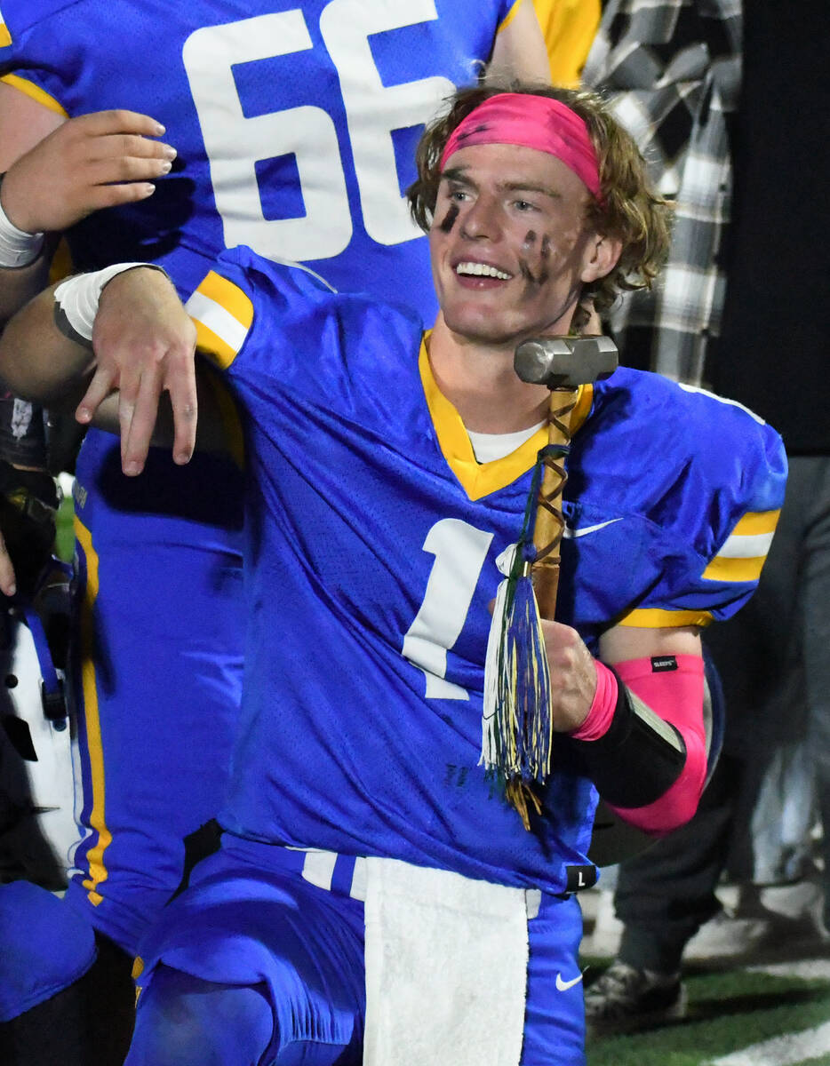 Moapa Valley quarterback Peyton Neilson poses with the Hammer following a 46-28 win over Virgin ...