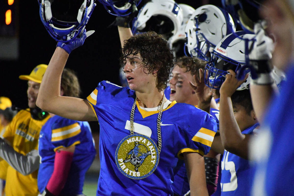 Moapa Valley’s Dustin Gordon sports the Pirate Turnover Chain after running back an inte ...