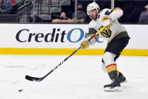 Vegas Golden Knights defenseman Daniil Miromanov hits the puck against the Los Angeles Kings du ...