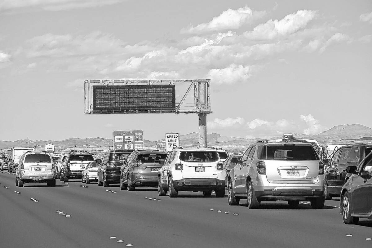 Traffic backs up on Interstate 15 as Electric Daisy Carnival attendees approach Speedway Boulev ...