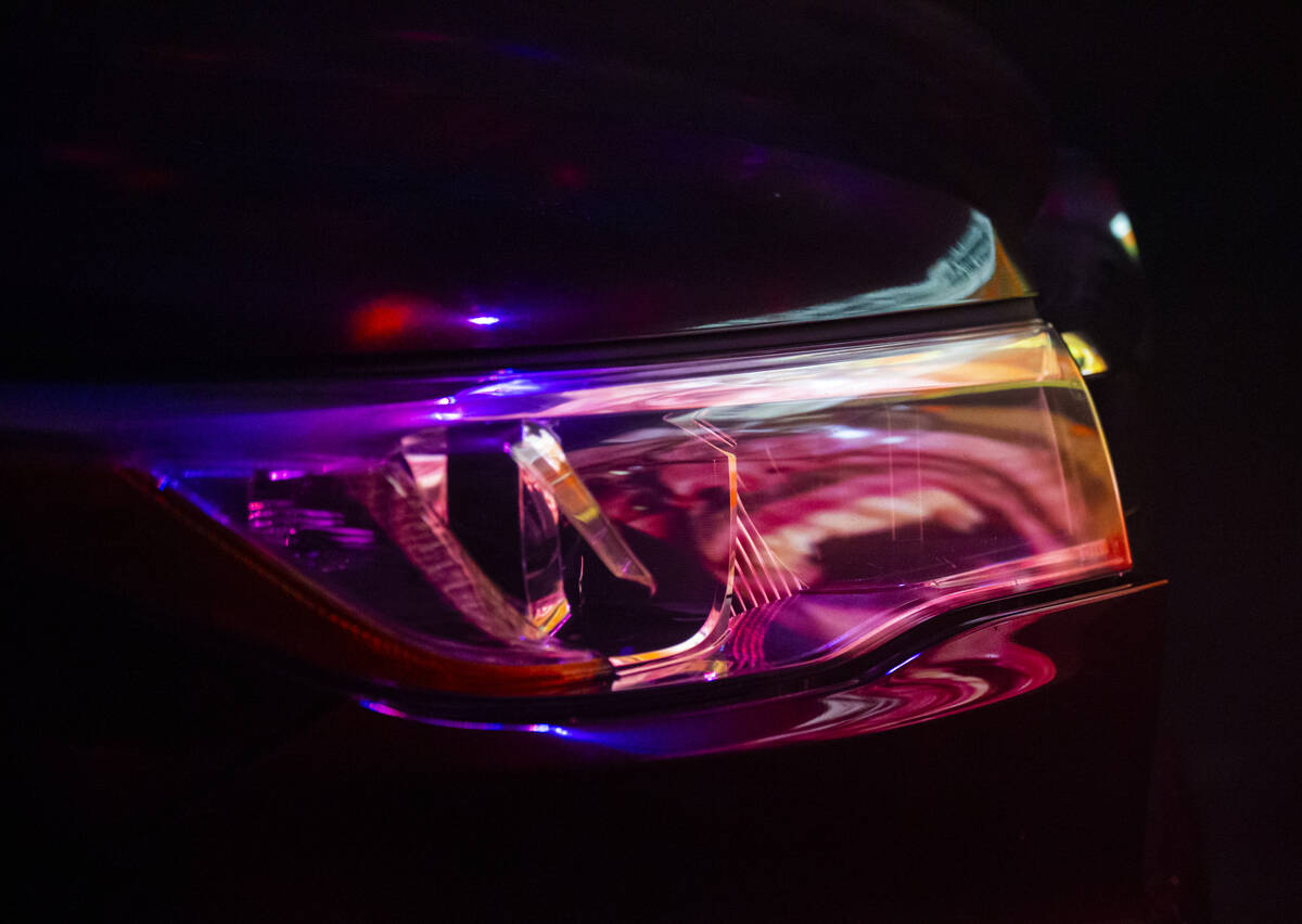 A video is reflected in a car headlight at the start of the Horrorwood Video drive-in at the Ma ...
